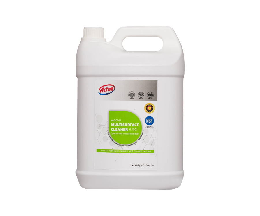 White plastic gallon jug labeled "Action Multi-Surface Cleaner" featuring green and white branding, and an NSF certification. Industrial and clean.