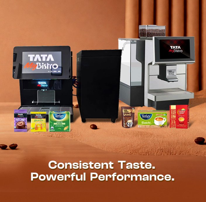 Two coffee machines labeled "TATA My Bistro" are showcased with various packaged beverages in front. Text reads "Consistent Taste. Powerful Performance." Brown backdrop with coffee beans.