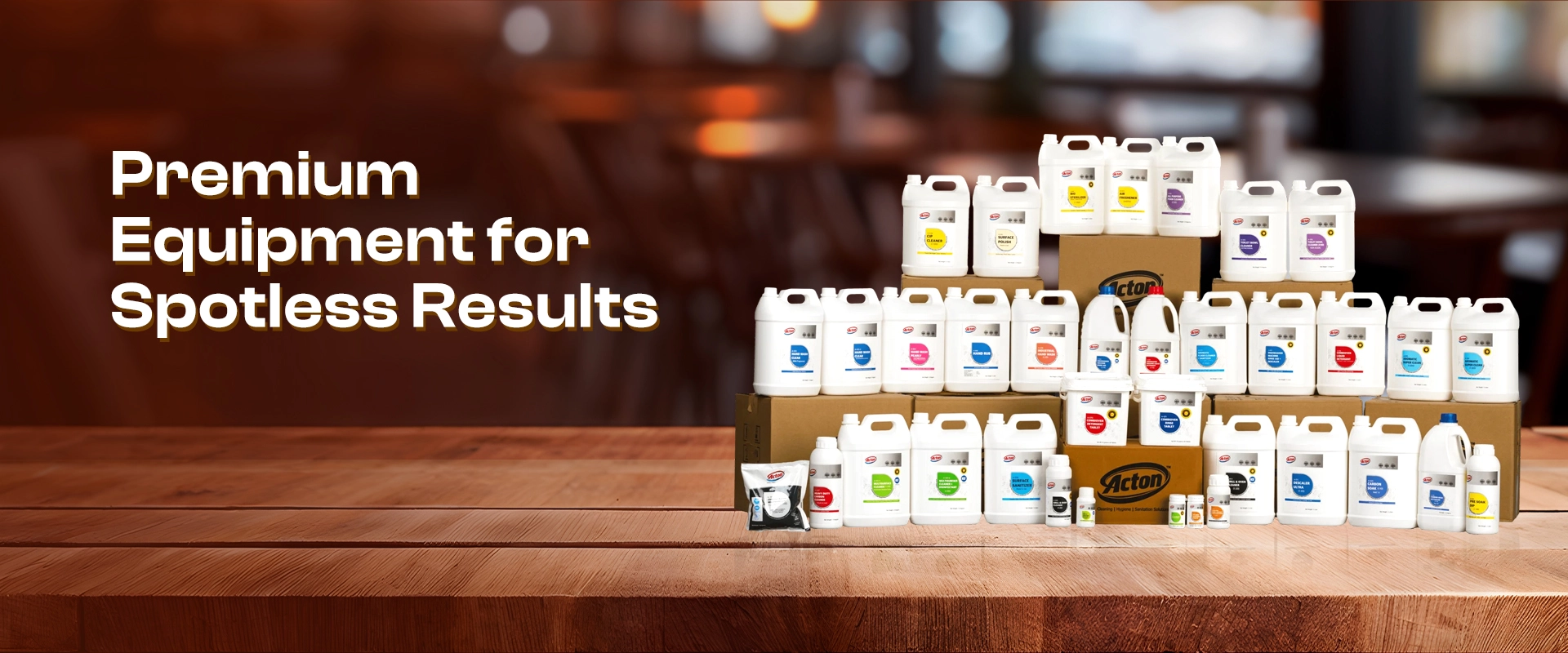 A pyramid of various cleaning products on a wooden table, with the text "Premium Equipment for Spotless Results" to the left. Warm, inviting ambiance.