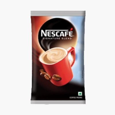 The image shows a Nescafe Signature Blend coffee packet featuring a red mug filled with creamy coffee and coffee beans, set against a dark backdrop.